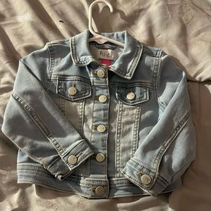 This light blue Jean jacket would look super cute for fun in the spring .